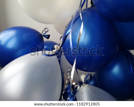 White and dark blue ballons in celebrate party time. Traditional congratulation with fancy balloons.