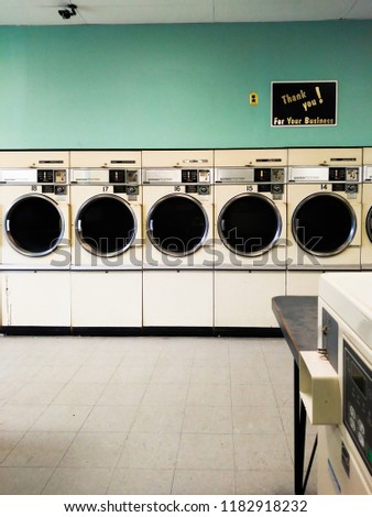Vintage Laundromat Dryers Royalty-Free Stock Photo #1182918232