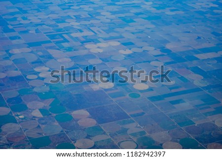 Aerial view of farm and river in the middle plain of USA