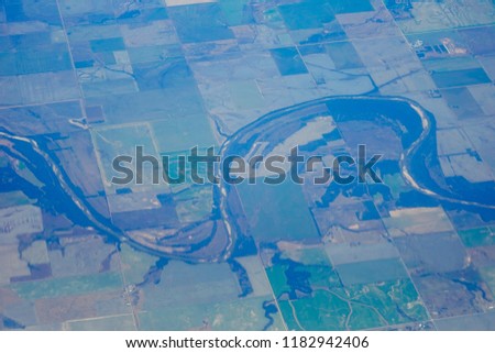 Aerial view of farm and river in the middle plain of USA