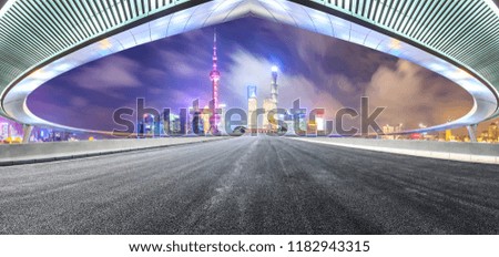 Empty asphalt road and modern city landmark building with bridge in shanghai