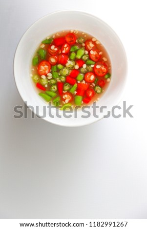 Fish sauce with Thai green and red fresh chilli in white cup