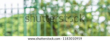 Abstract blurred nature background with bokeh for creative designs. Green leaves bokeh out of focus background from nature forest. Green Nature spring and natural light in blur style with copy space.