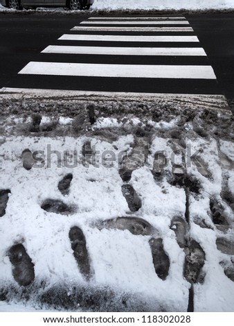 Crosswalk slush. Pedestrian crossing in winter. Abstract background.