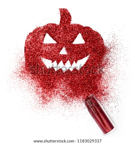 Abstract explosion Halloween shining pumpkin silhouette with red glitter and container isolated on white background creative concept