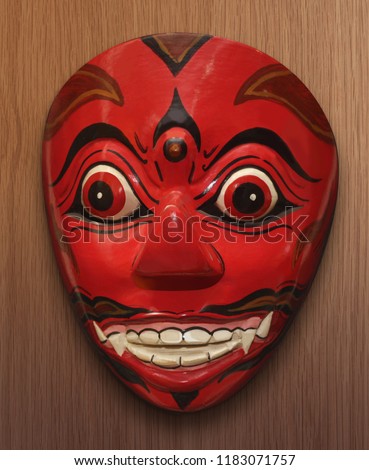 Wayang topeng Kala, is one of the giant puppet characters, has a red face and has fangs.