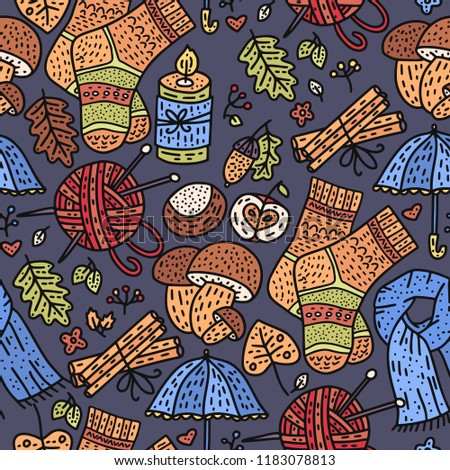 Cozy fall hand drawn vector seamless pattern. Autumn doodle detailed illustration with coziness ornate elements - mushrooms, clothes, acorn, thread, knitting, candle, chestnut and more.