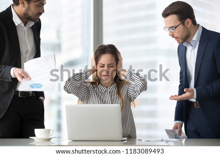 Stressed frustrated female CEO or boss closing ears abstracting from annoying colleagues or subordinates, woman feeling despair avoiding bothering clients, ignoring solving problems, do not want work Royalty-Free Stock Photo #1183089493