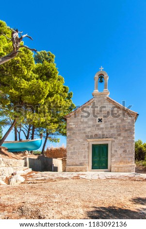 Old stone church in Croatia on the island of Hvar. Hot day at the Adriatic Sea. Christian church. Greetings from Croatia. Historic building