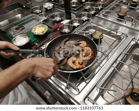Italian Chef : Cook shrimp for seafood rice cazuela for restaurant