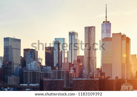 New York City skyline at sunset, color toned picture, USA.