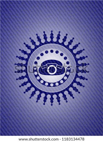 phone icon inside emblem with denim high quality background