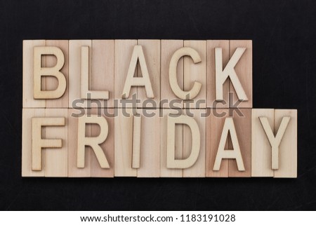 black Friday - text in wooden letters on blackBoard. Copy space.
