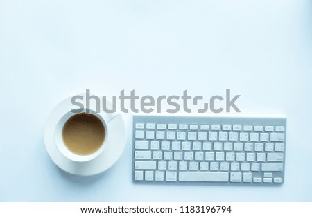 White office desk table with coffee keyboard . Top view with copy space, flat lay.