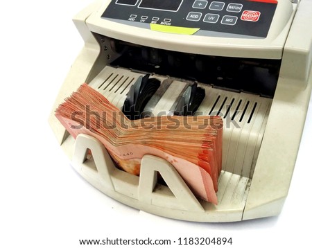 Bank note on count machine with isolated white background. Malaysia Ringgit (MYR) RM10