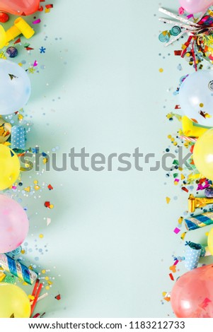 Flat lay decoration party concept on pastel blue background top view