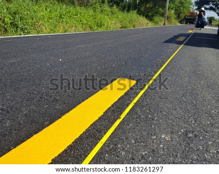 Asphalt road with pair of yellow line.background and texture. Soft focus,Select focus