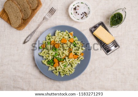 Traditional pasta with vegetables and pesto sauce. Selective focus.