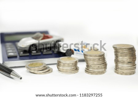Business concept of car loan, gray car and stacks of coins, money management for car concept, finance concept trade car for cash, isolated on white background