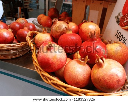 Ripe pomegranates, fruit in a basket, farmers market