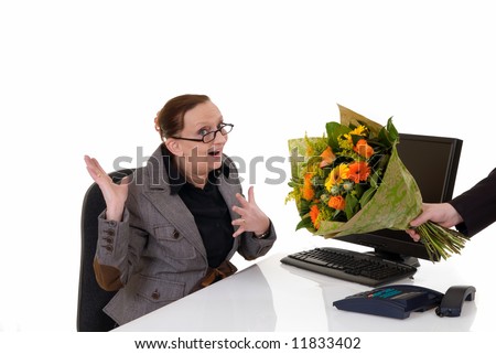 Attractive middle aged woman getting flowers for birthday, promotion, secretary day,  white background,  studio shot.