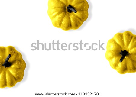 Creative Halloween layout with golden pumpkins on white background. Flat lay.