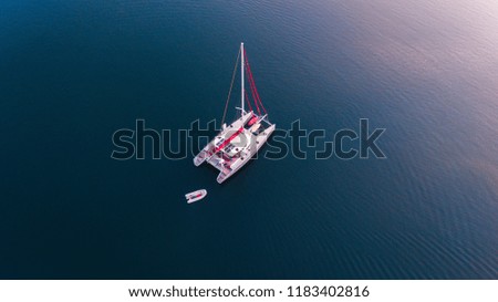 Top view of sailboat yacht. Isolated on the sea texture. Participant of sail Indonesia