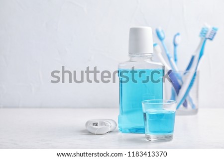 Oral care products and space for text on light background. Teeth hygiene Royalty-Free Stock Photo #1183413370