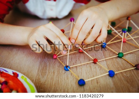 child making geometric shapes, engineering and STEM