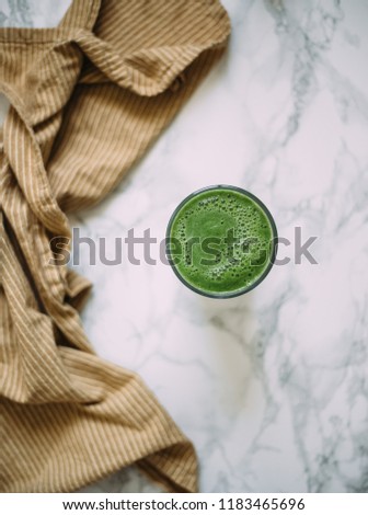 Spinach smoothie on marble background