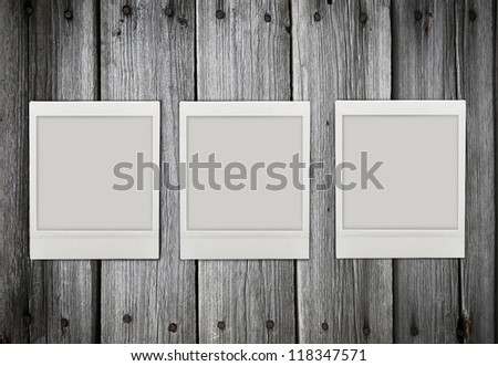 three empty  photos  on wood texture
