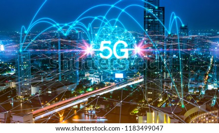 5G network digital hologram and internet of things on city background.5G network wireless systems. Royalty-Free Stock Photo #1183499047