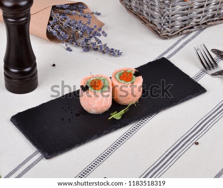 A plate of fish rolls for a buffet or a banquet