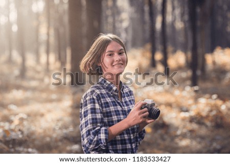 Young tourists taking pictures in the forest ,The concept of tourism