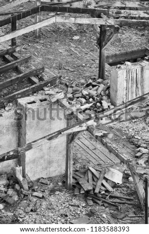 Black and white picture of a destroyed building, disaster concept.