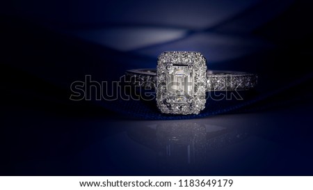 Diamond ring on dark blue background,wedding ring, engagement ring,solitaire Royalty-Free Stock Photo #1183649179