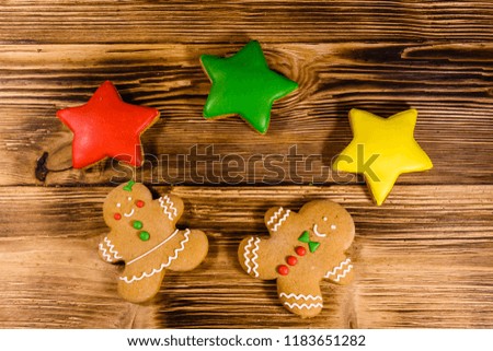 Different christmas gingerbread cookies on rustic wooden table. Top view