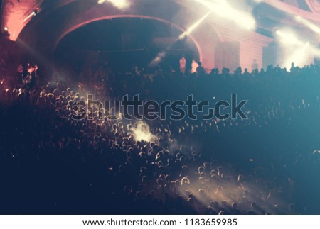 Concert crowd and lights blurred background
