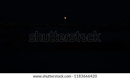 full moon and light lanterns in night sky