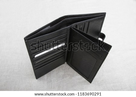 Empty wallet on a light background; open men's wallet