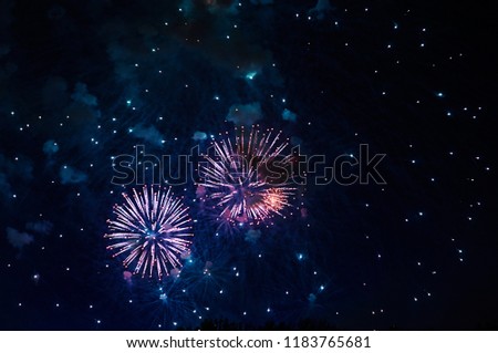 Inexpensive fireworks, over the city, red and blue . For any purpose