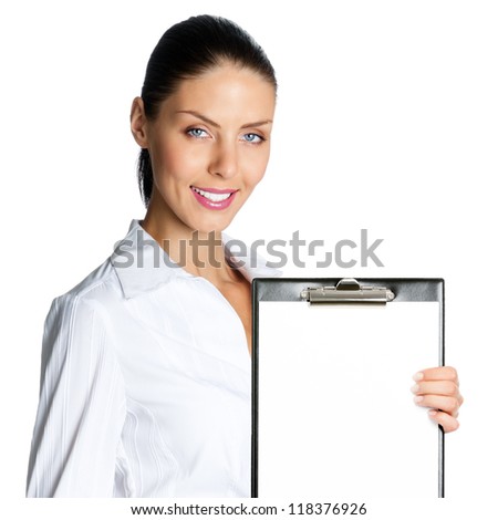 Happy smiling beautiful young business woman showing blank clipboard, isolated over white background