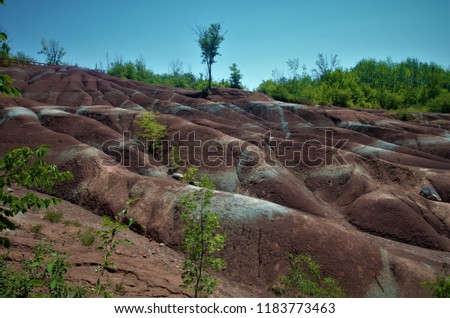The beautiful red colored earth of Cheltenham badlands in Caledon, Ontario is one of the favorite hiking trails near the city of Toronto.