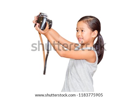 Beautiful smiling girl holding a camera. (clipping path)