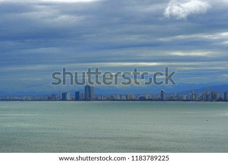 Da Nang Bay under cloudy sky with many seaside buildings in Vietnam  rainy day