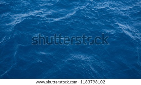 a deep blue sea water texture view from top Royalty-Free Stock Photo #1183798102