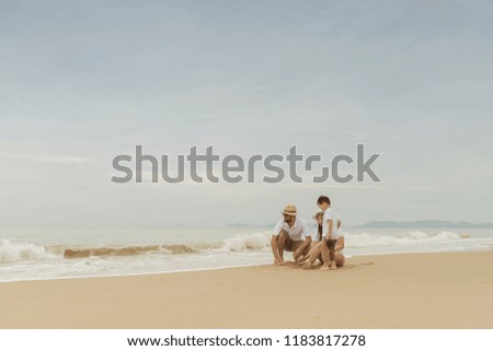 happy family with two kids on the beach, Happy family on sea beach at resort