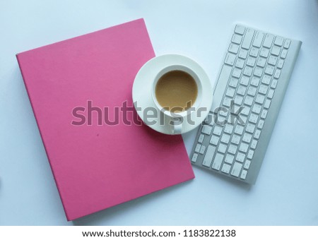 White office desk table with coffee keyboard and

Notebook . Top view with copy space, flat lay.