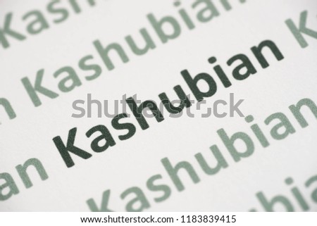 word Kashubian language printed on white paper macro