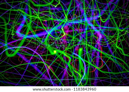 Abstract background consisting of colorful chaotic lines and stripes.